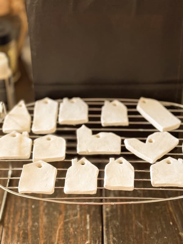Air dry clay ornaments drying on a rack