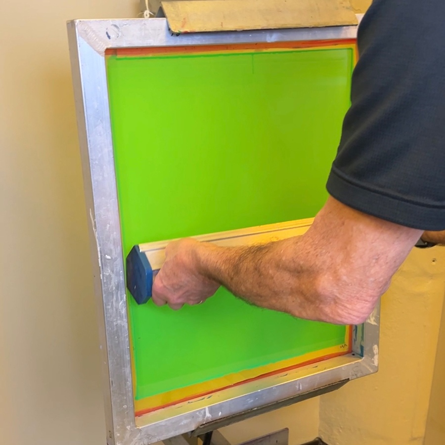 Photo emulsion being coated onto a screen printing frame
