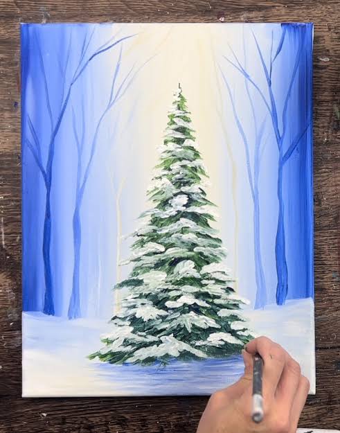 Simple acrylic Christmas painting of a snowy fir tree on a deep blue canvas